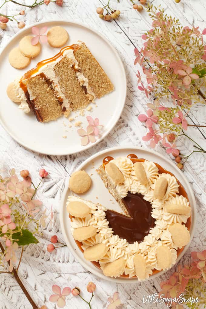 millionaire cake with caramel and chocolate sauce with a slice removed.