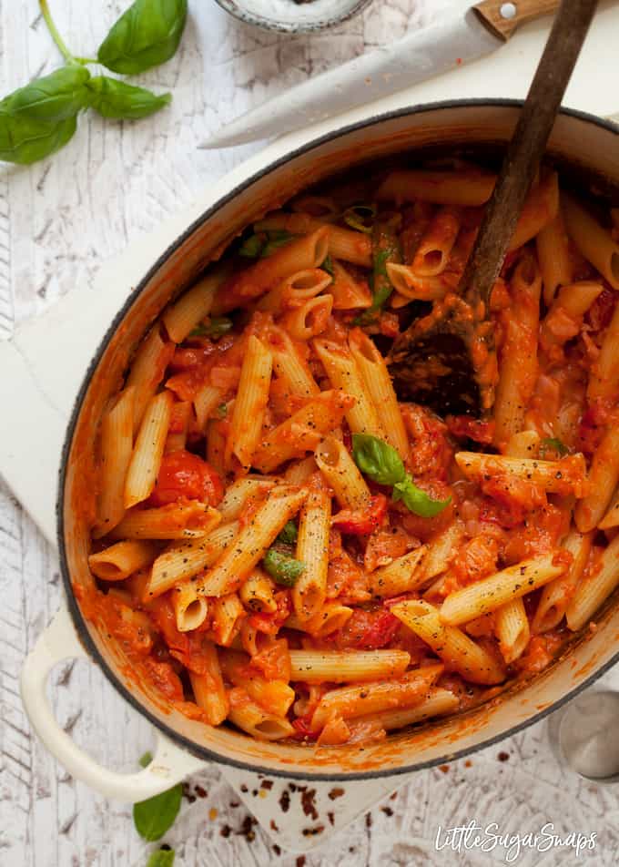 A pan of penne alla vodka with smoked salmon ready to serve.