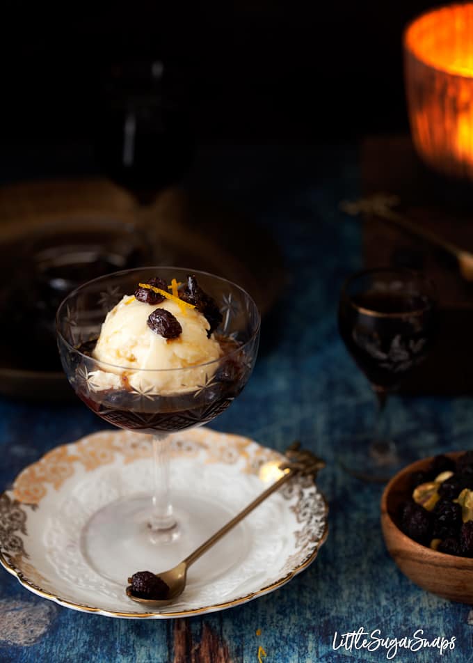 Sherry affogato dessert served in a cocktail glass with vanilla ice cream and dried fruit.