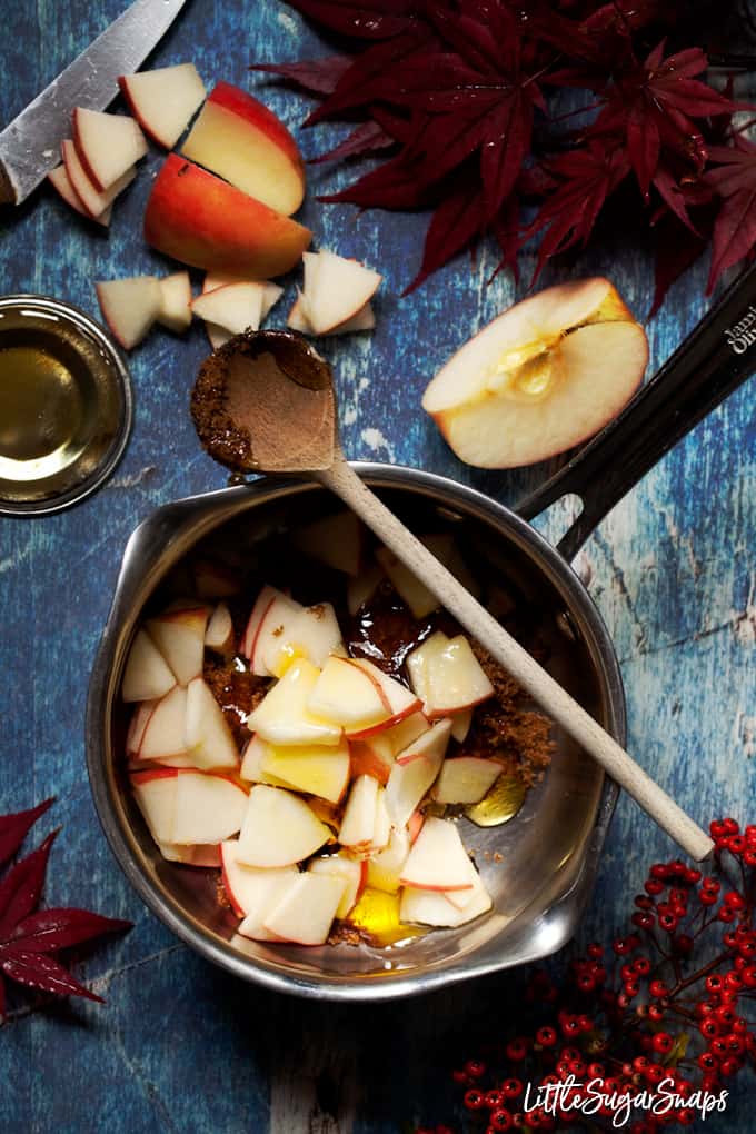 making toffee apple sauce - ingredients including apple, butter, syrup and brown sugar in a pan.