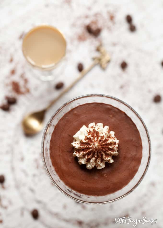 overhead view of Baileys chocolate mousse topped with whipped cream and chocolate flakes.
