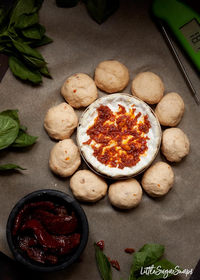 step by step process shot of assembling a dough ball and baked camembert wreath