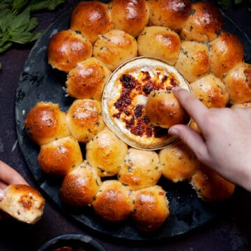 Dough Ball and Baked Camembert Wreath being pulled apart by 2 people