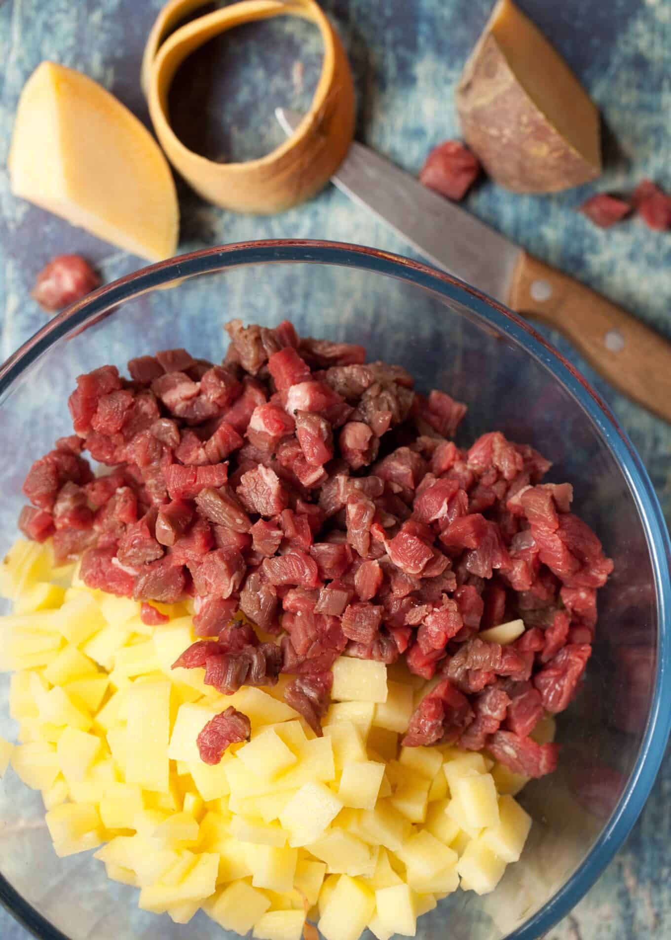 sliced potato and diced beef skirt in a bowl