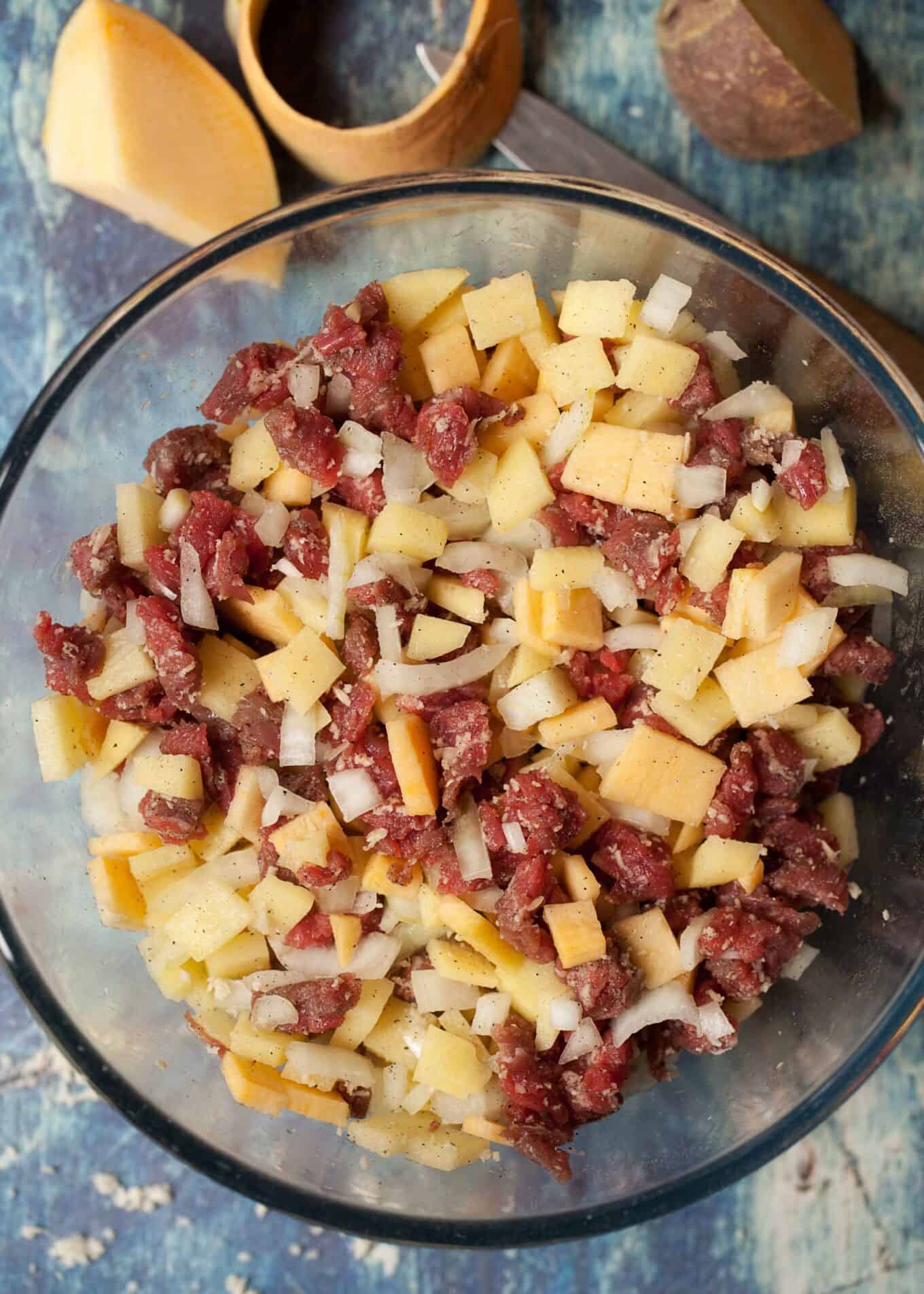 ingredients for a traditional beef pasty recipe in a bowl