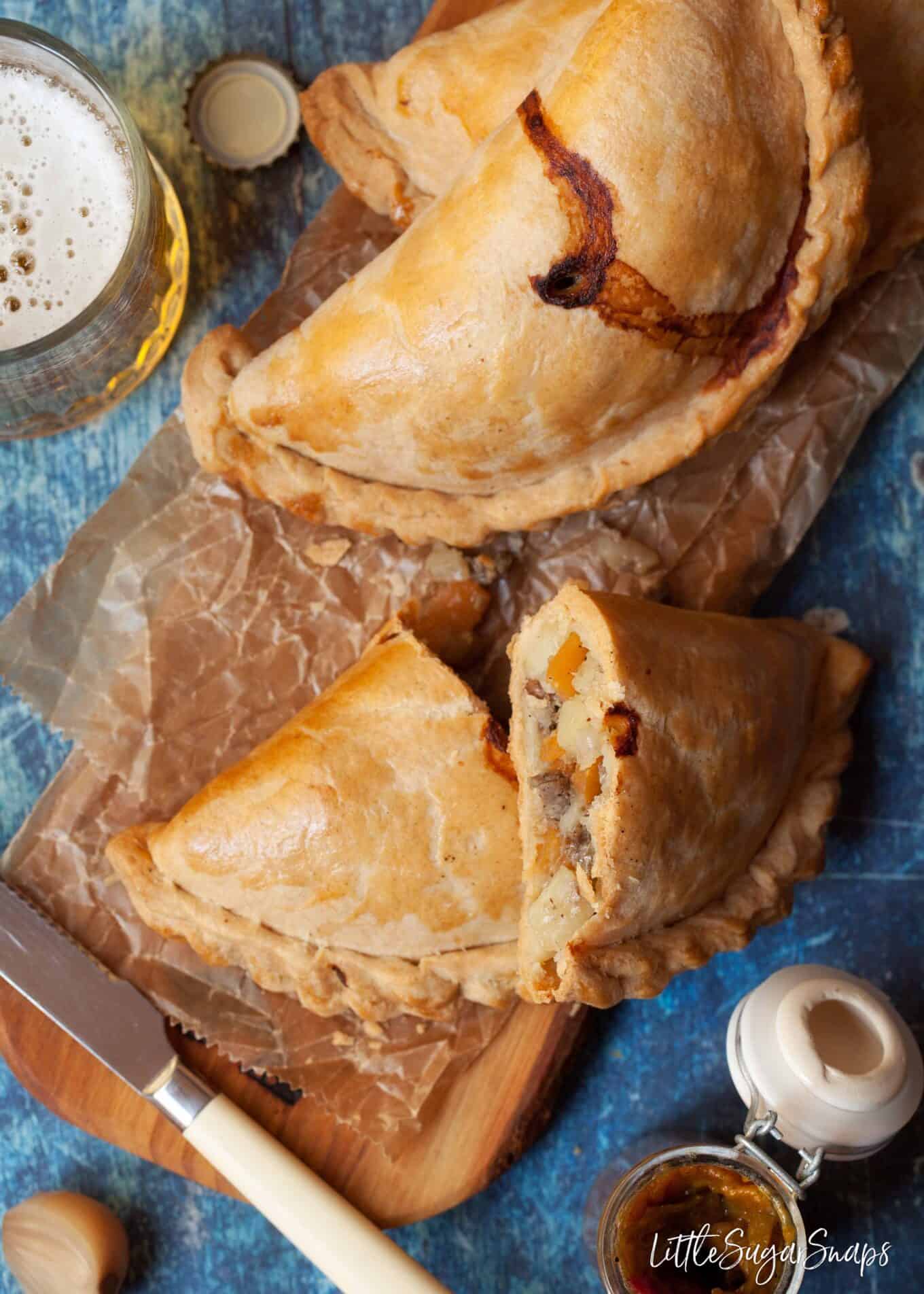 Beef pasties - one cut open to reveal the filling.