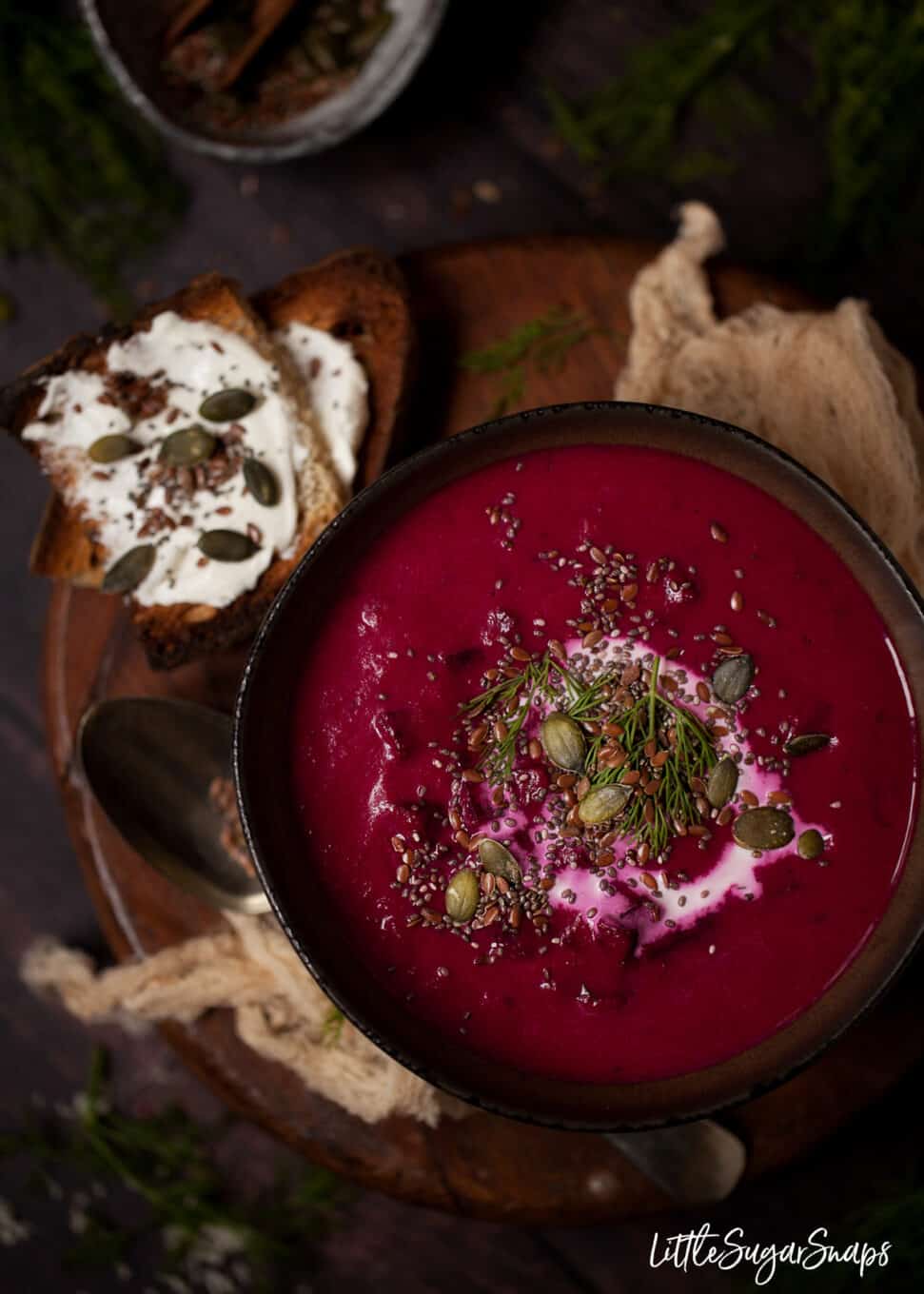 Beetroot and horseradish soup topped with cream, mixed seeds and dill.