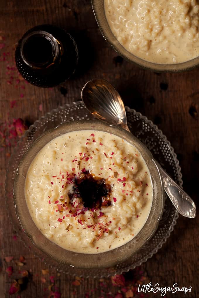 Comforting milk based dessert with rosehip syrup and crushed rose petals.