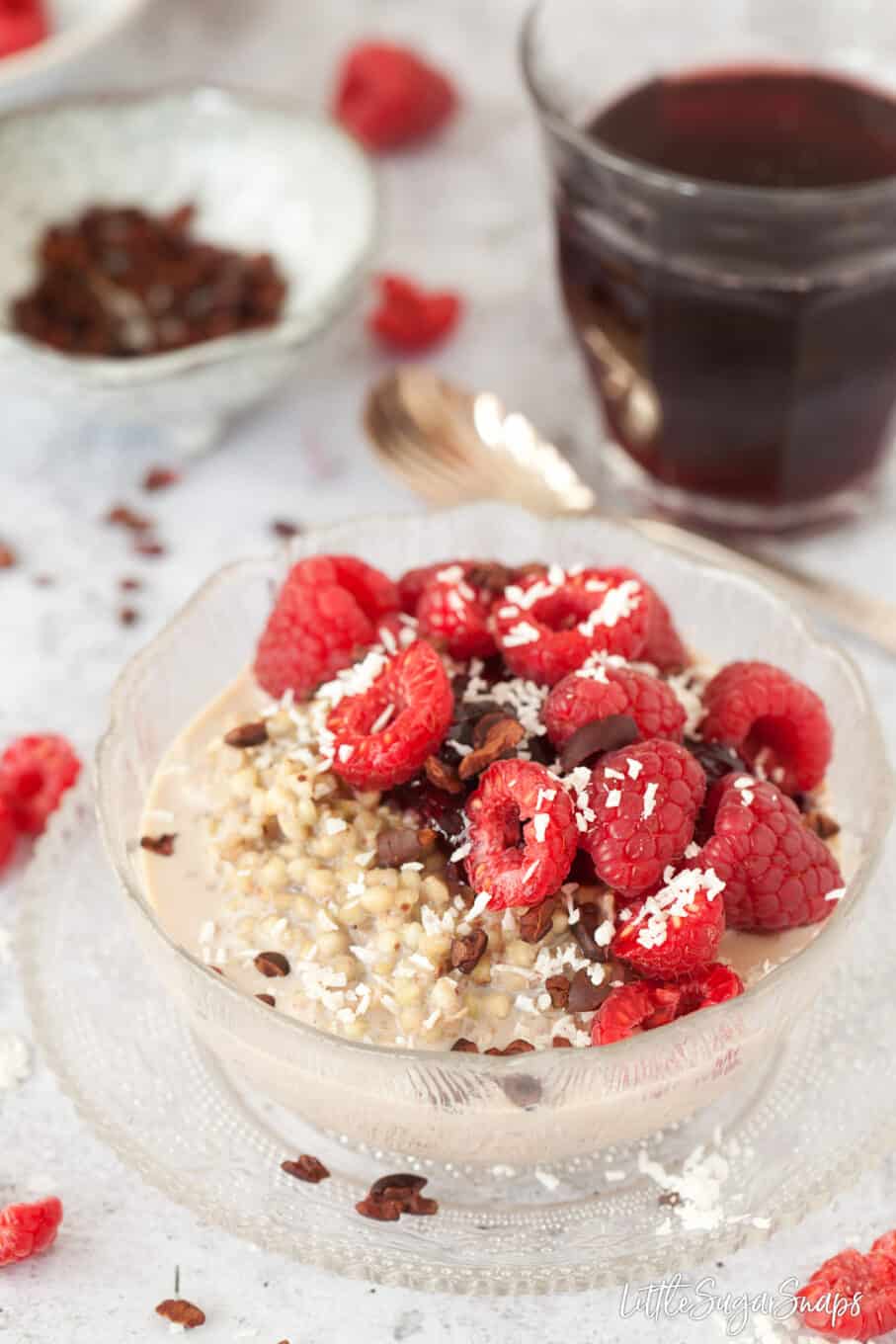 Gluten free Porridge with fresh fruit and cocoa nibs.