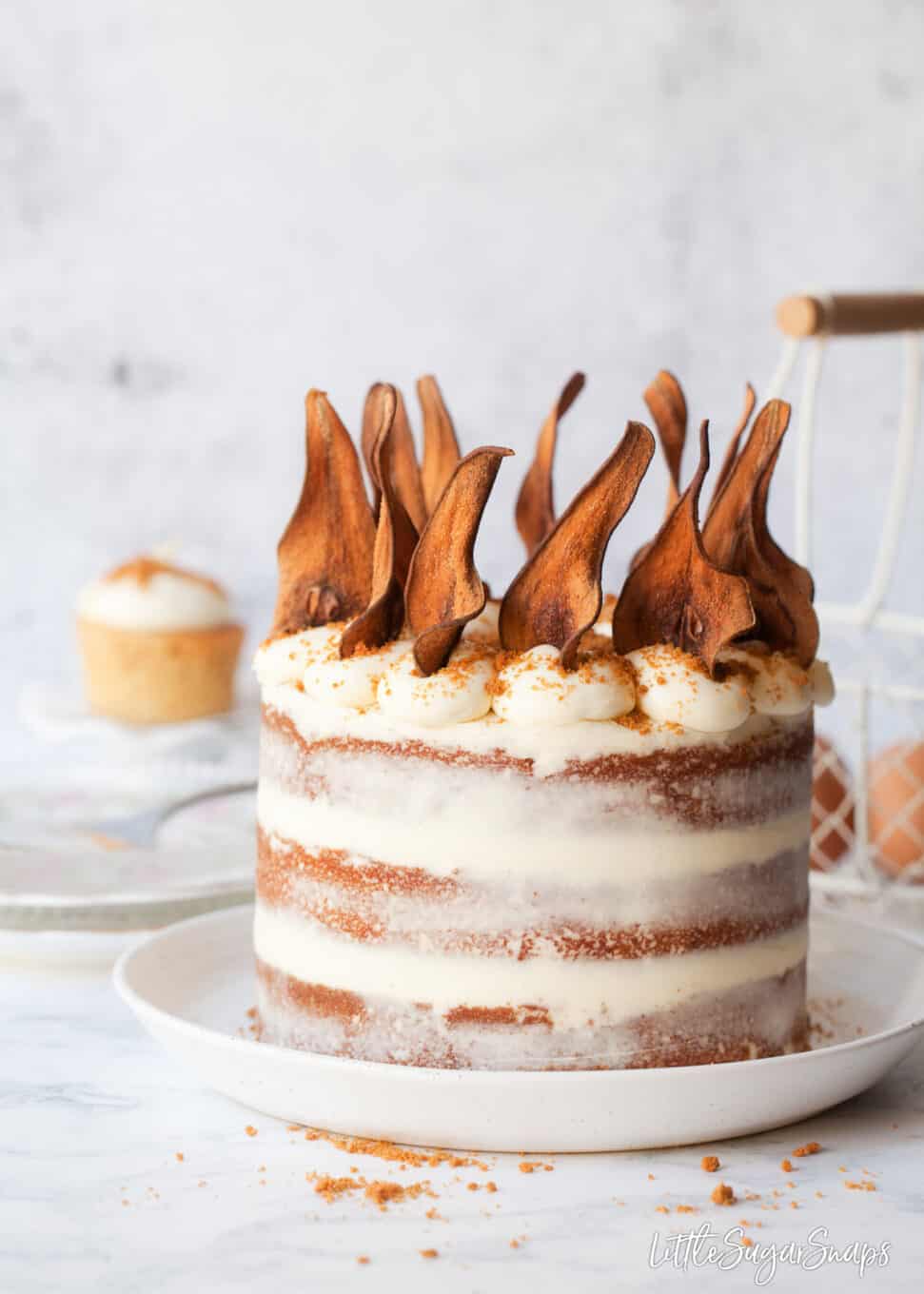 Pear wafers topping a Lotus Biscoff cake with white chocolate mascarpone frosting.