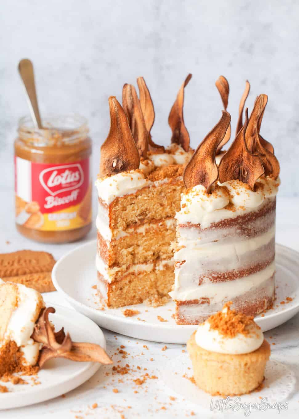 Cut into triple layer Biscoff cake with pear wafers adorning the top.