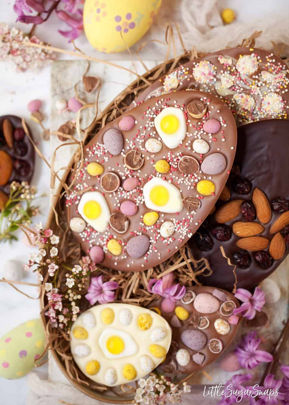 Tray of homemade easter eggs with a variety of toppings.
