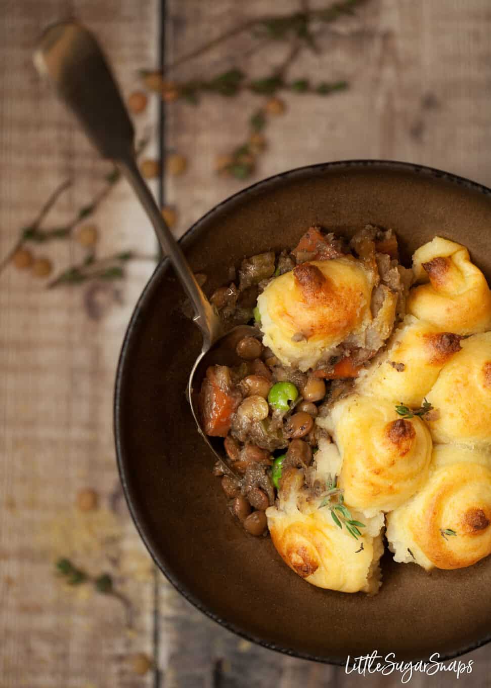 A serving of vegan lentil shepherd's pie in a bowl.