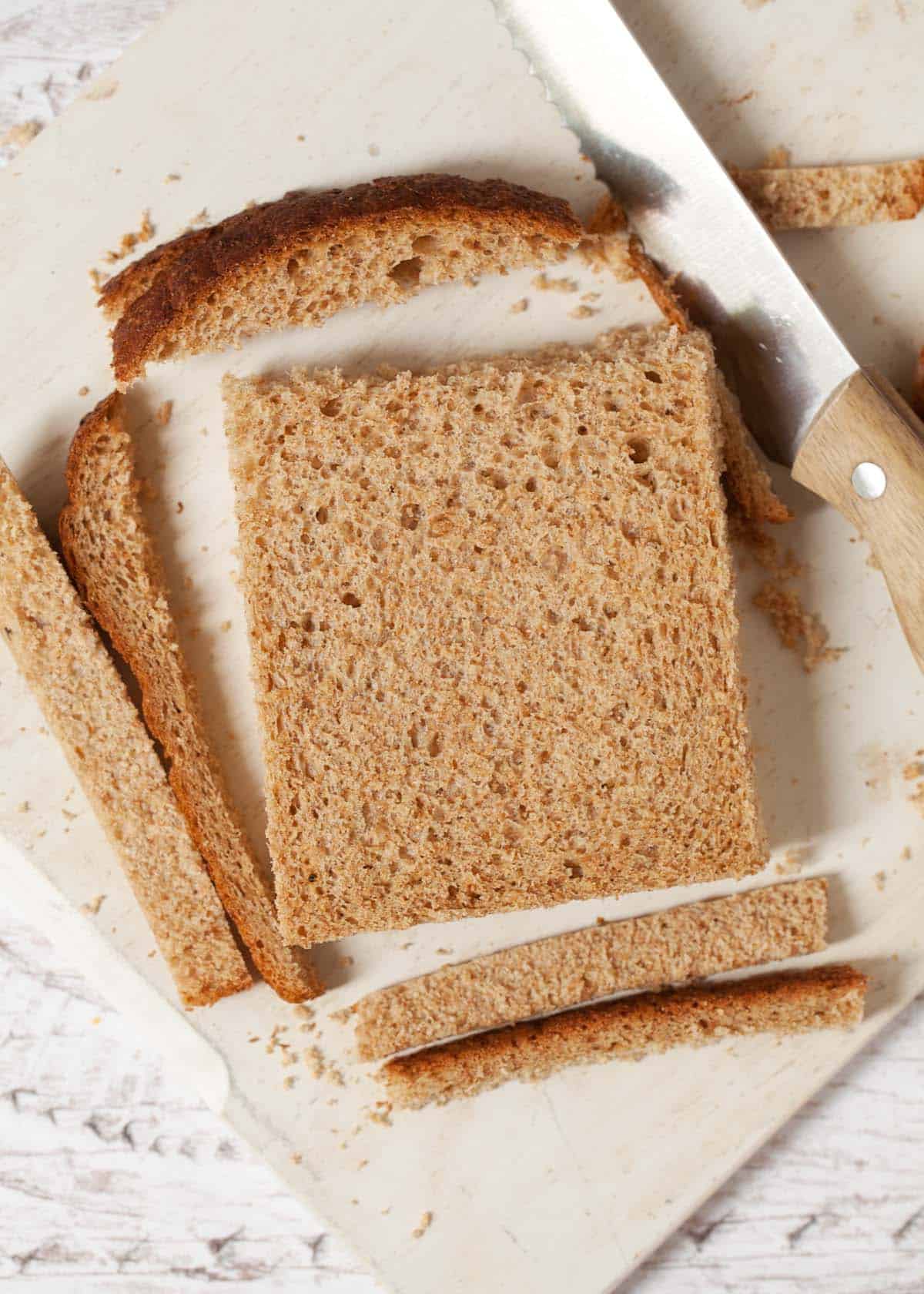 making sandwiches for afternoon tea: step one is cutting off the crusts