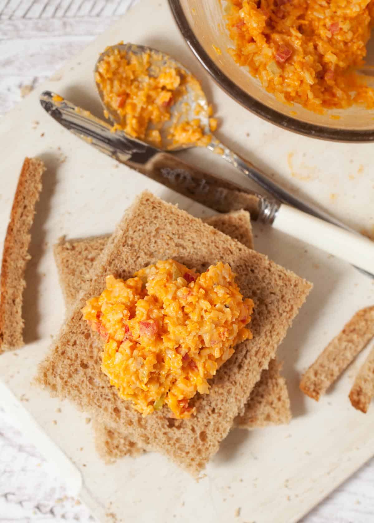 step two - add a large spoonful of cheese savoury sandwich filling to one slice of bread