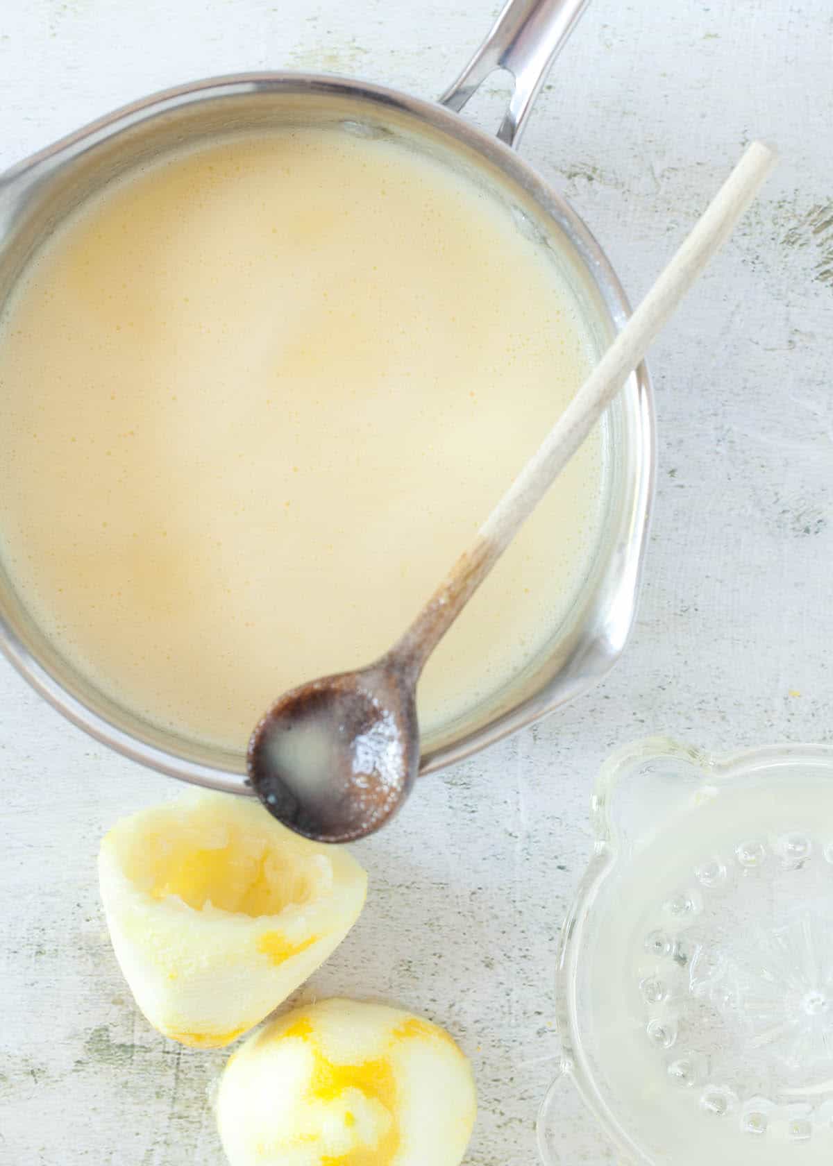 process shot - cooked cream with lemon zest for a lemon posset recipe