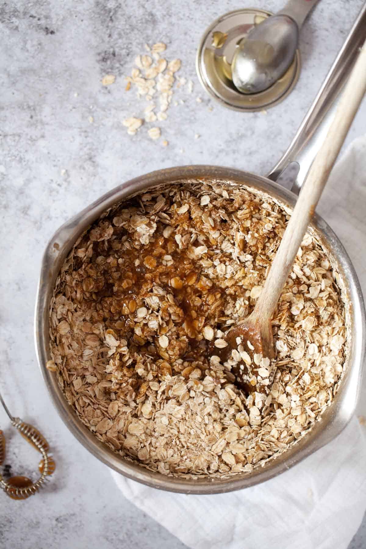 Mixing oats into other ingredients for oat bars