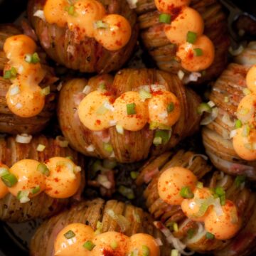 Cheesy Hasselback Potatoes with Bacon, cheese spread, spring onion and paprika