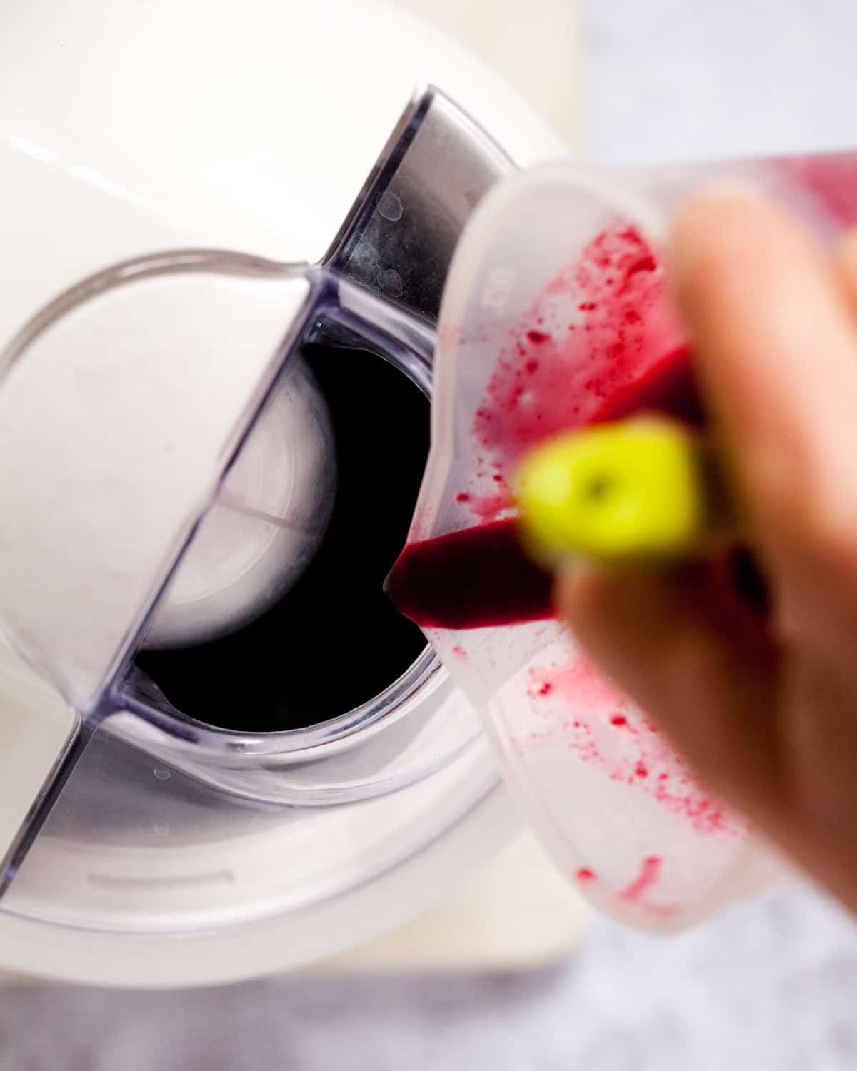 Pouring sorbet mix into an ice cream churner