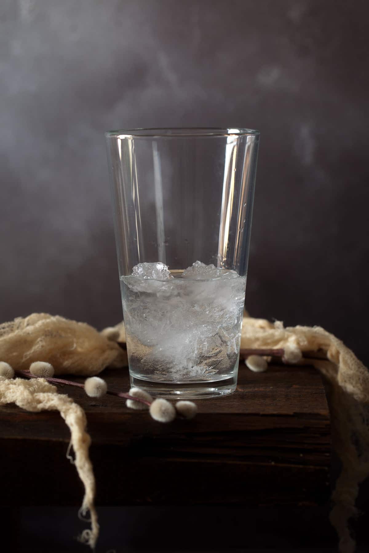 Ingredients for a cocktail in a glass filled with ice