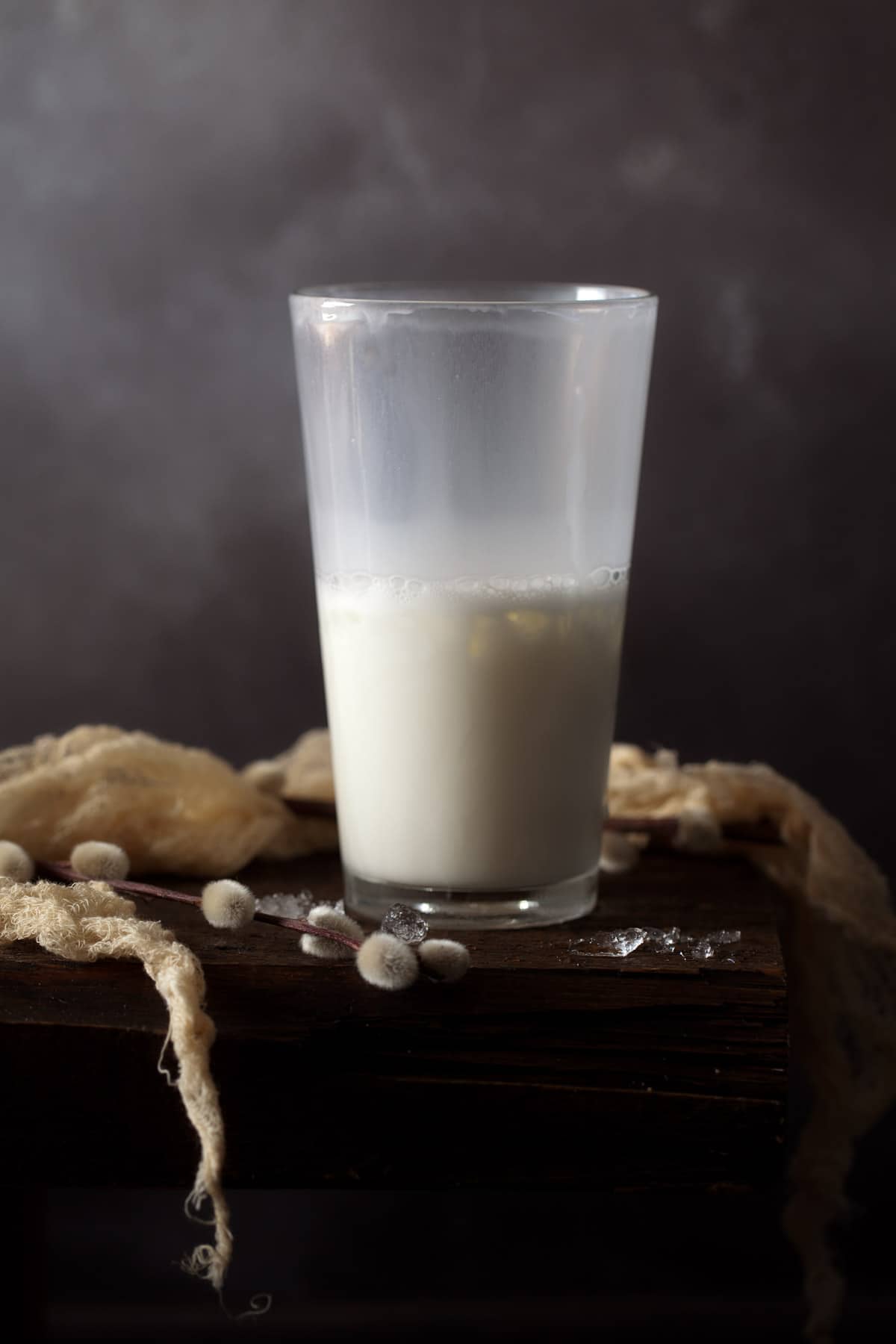 a creamy gin cocktail in a shaker after being shaken with ice