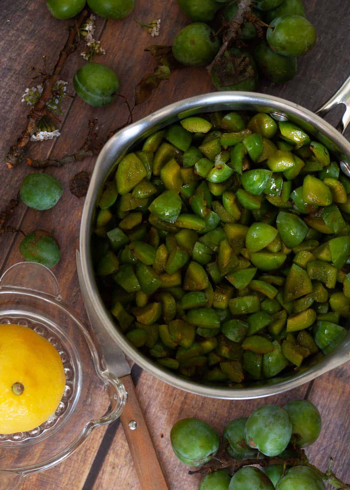 Chopped greengages in a pan ready for cooking into jam