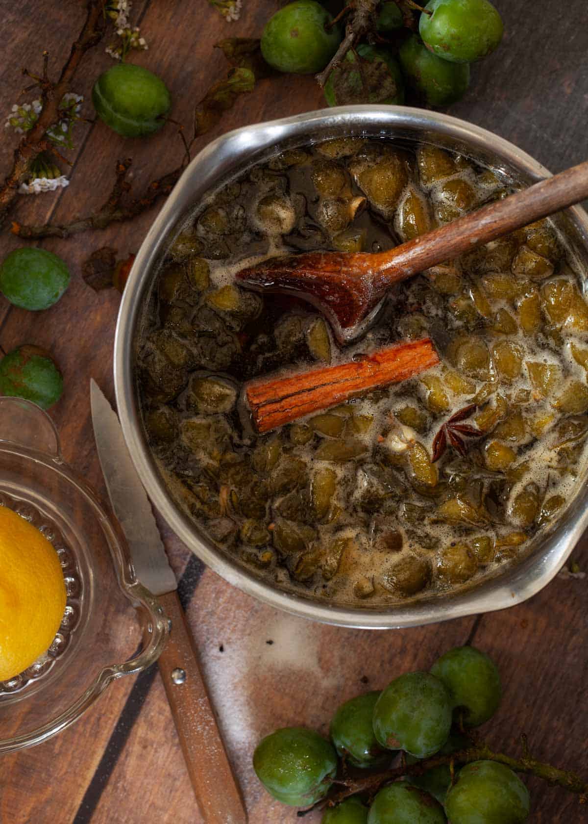 Process shot - part cooked spiced fruit preserve in a saucepan