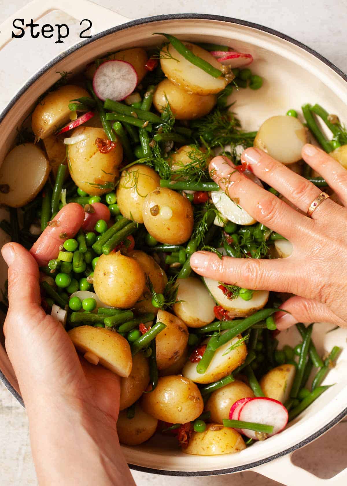 Process image - tossing salad ingredients by hand