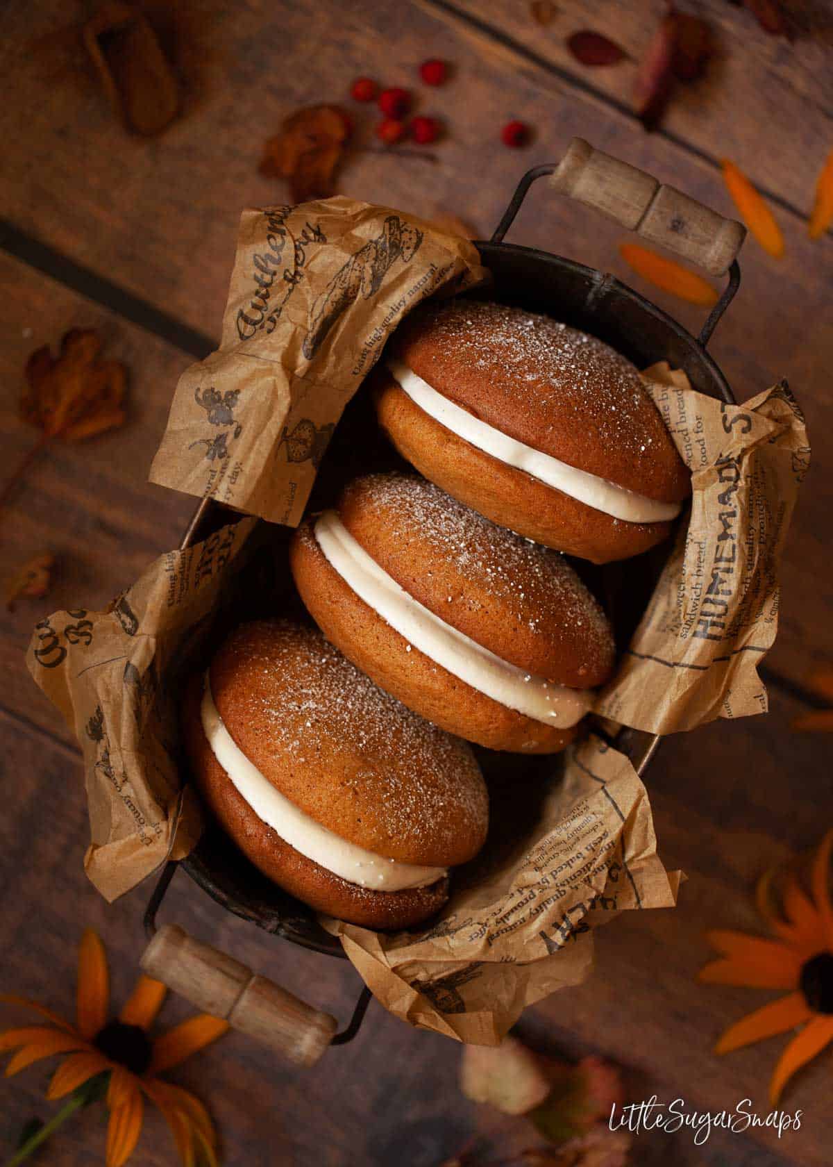 Overhead view of three Maine  whoopie pies in a tin