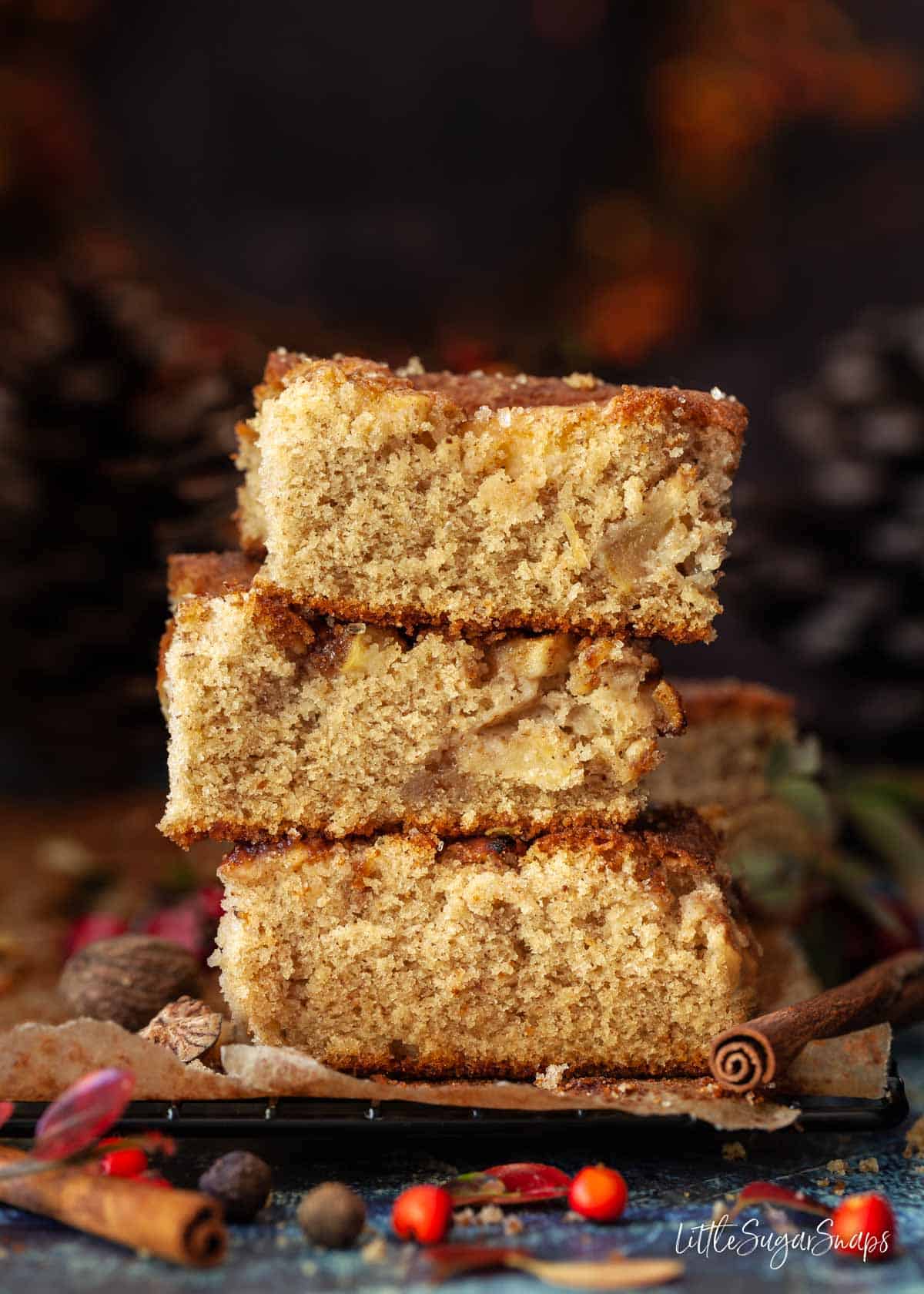 Slices of apple cake stacked on top of each other.