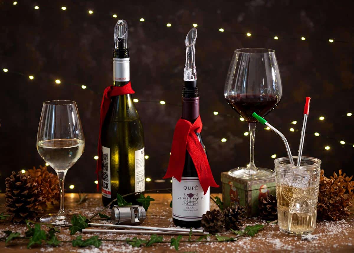 A selection of drinks, bottles and barware on a table