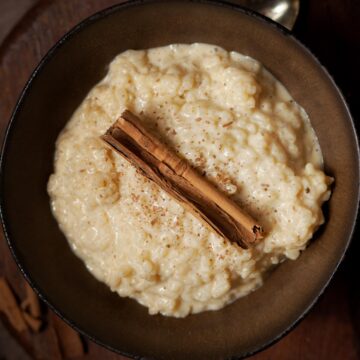 A bowl of stovetop rice pudding topped with cinnamon