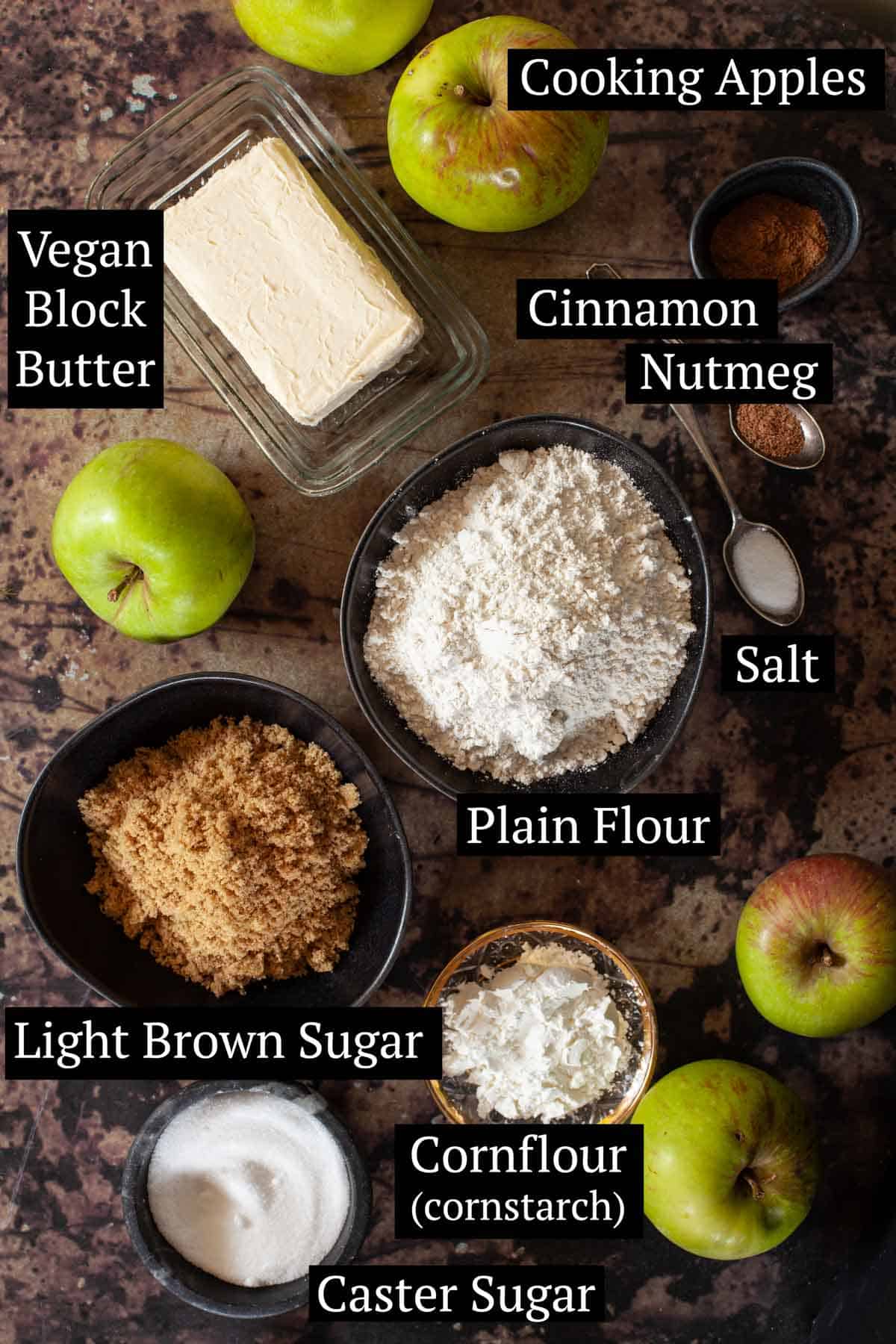 Ingredients for apple pie in bowls