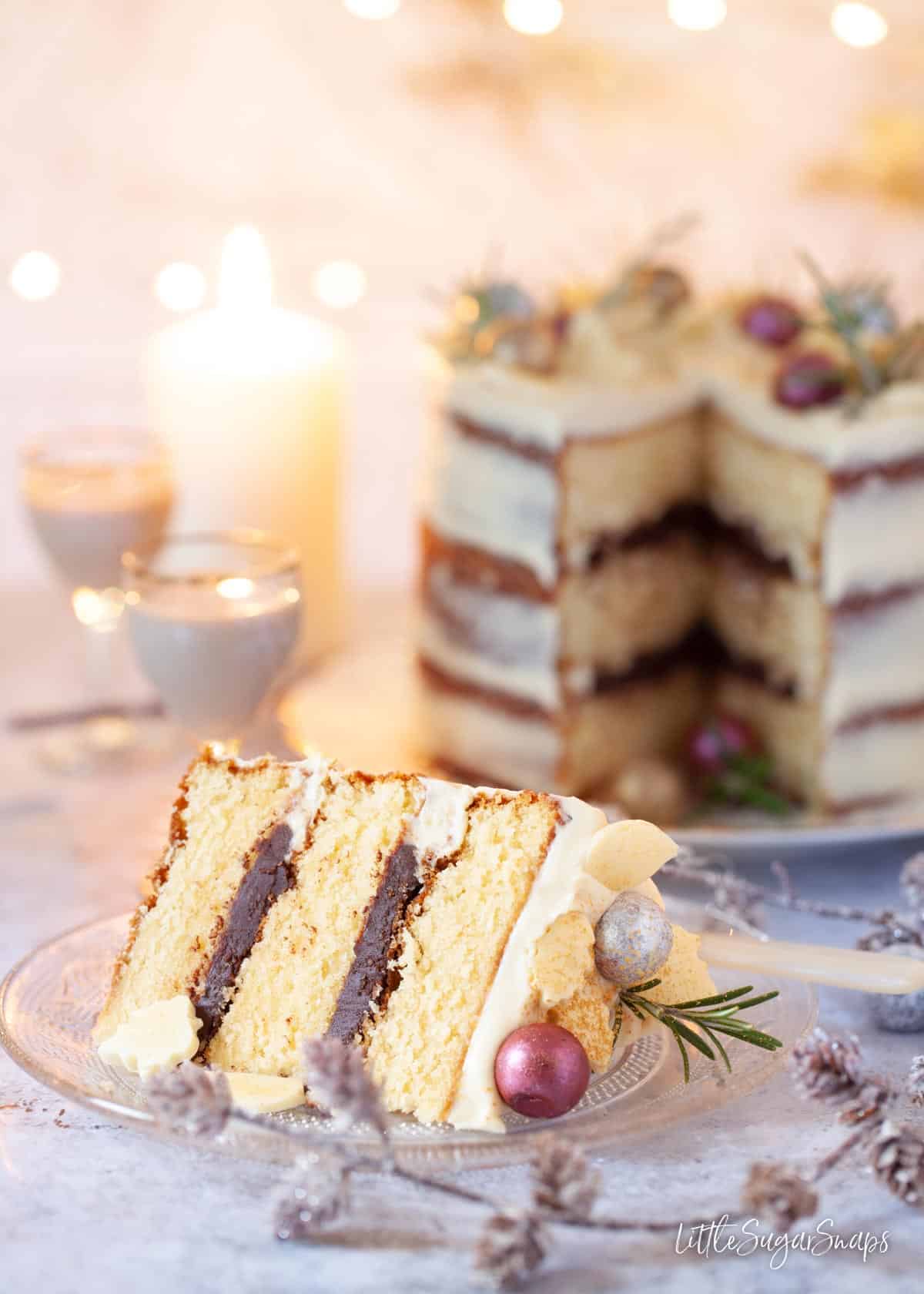 A slice of chocolate Baileys cake in front of the cake it was cut from