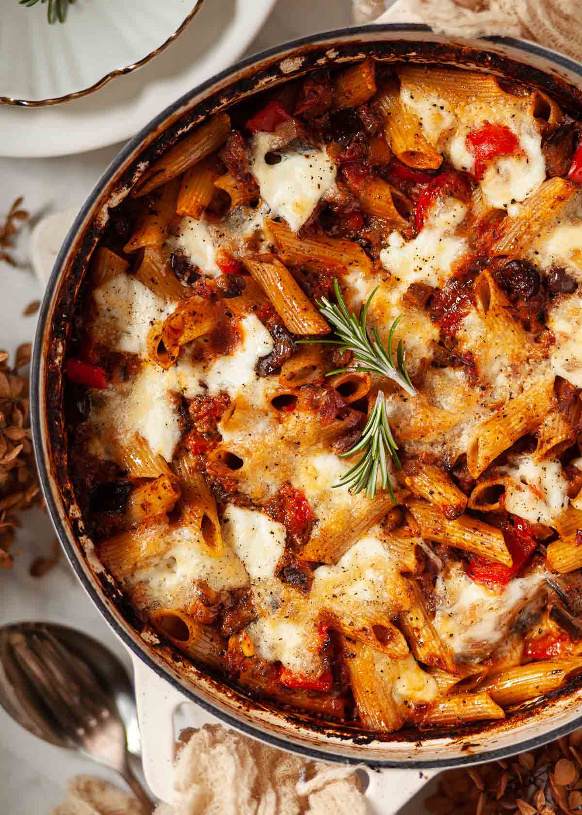 A cooked aubergine pasta al forno in a large overproof pot