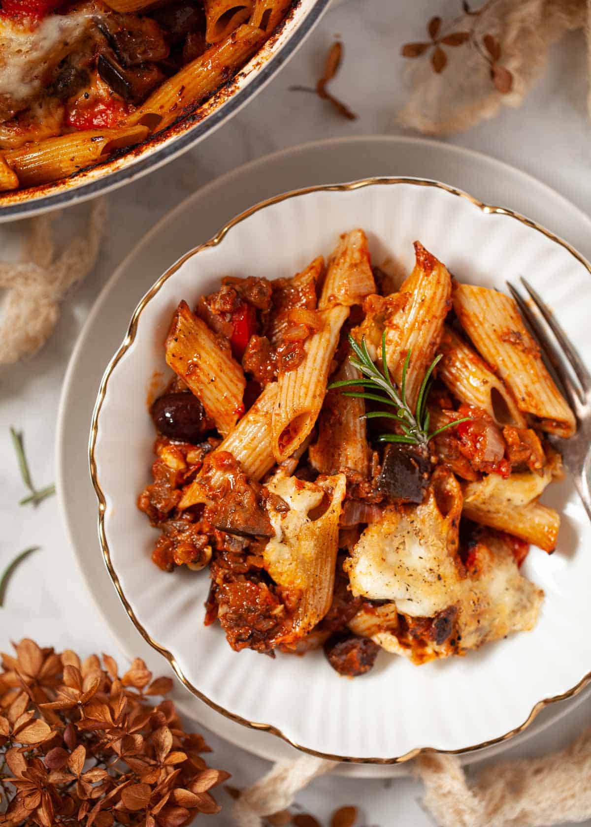 A serving of vegetarian pasta al forno in a white bowl