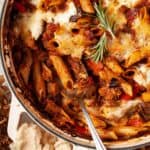A pan of pasta al forno with aubergine ragu