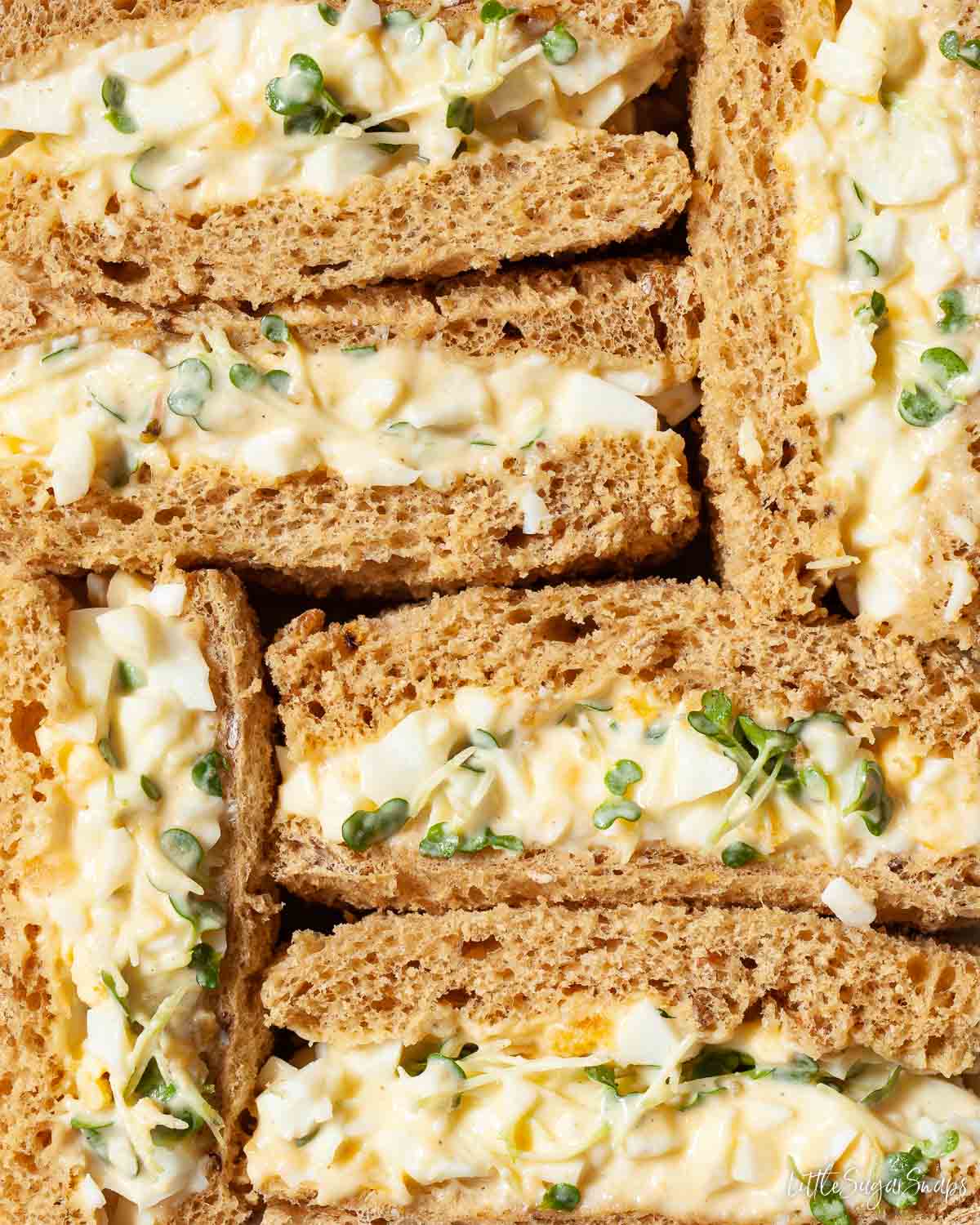 Close up of egg mayo sandwiches made on brown bread