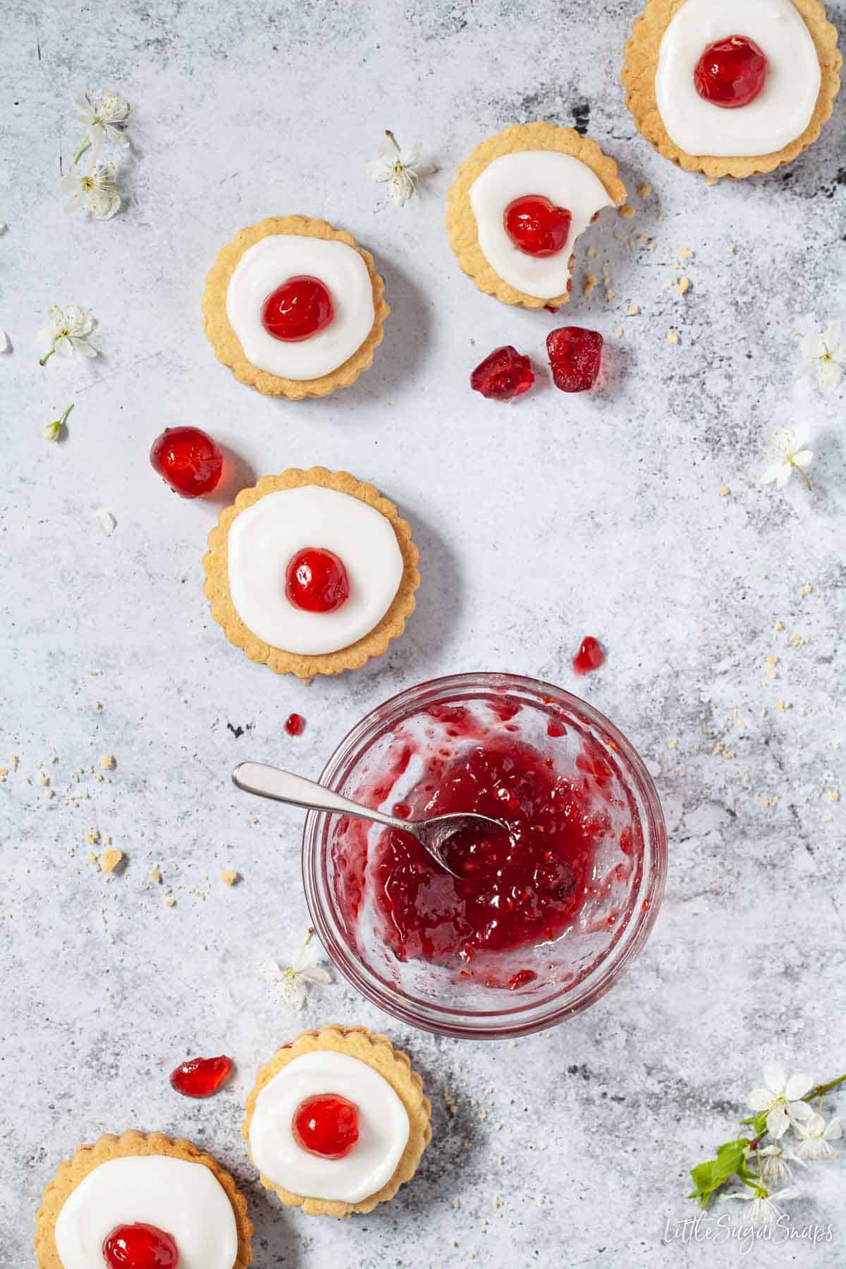 Empire biscuits with a bowl of raspberry jam