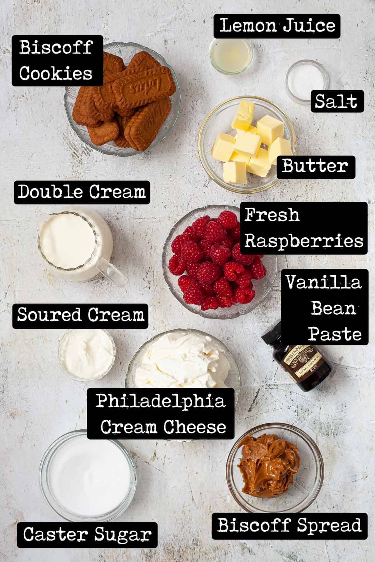 Ingredients in bowls with text overlay for a recipe using cookies, cream cheese and raspberries