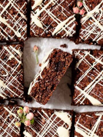 Chocolate flajack squares with one on its side to reveal the inside