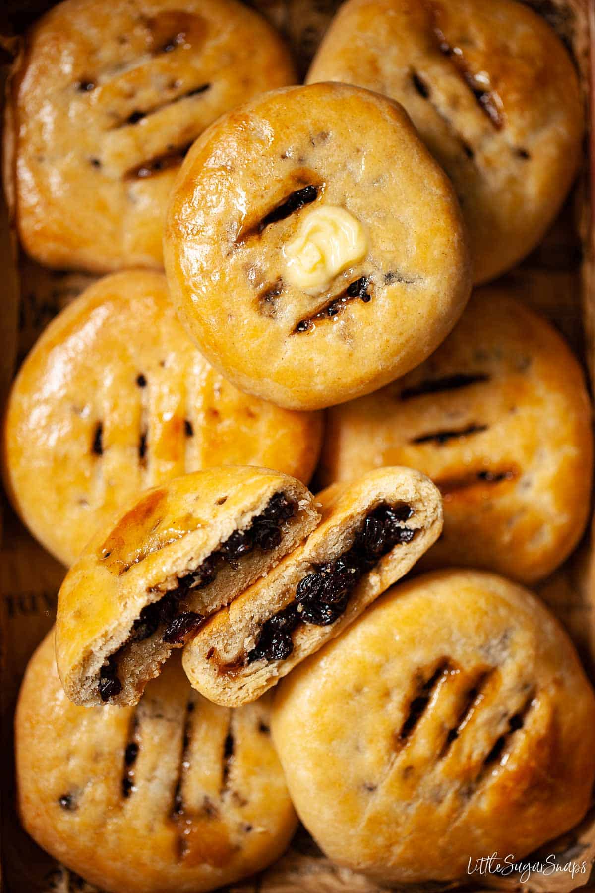 Close up of Chorley cakes, one split open and one with butter on top