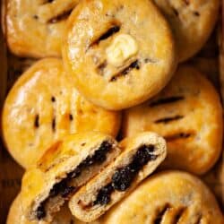 Close up of Chorley cakes, one split open and one with butter on top