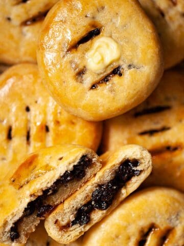 Close up of Chorley cakes, one split open and one with butter on top