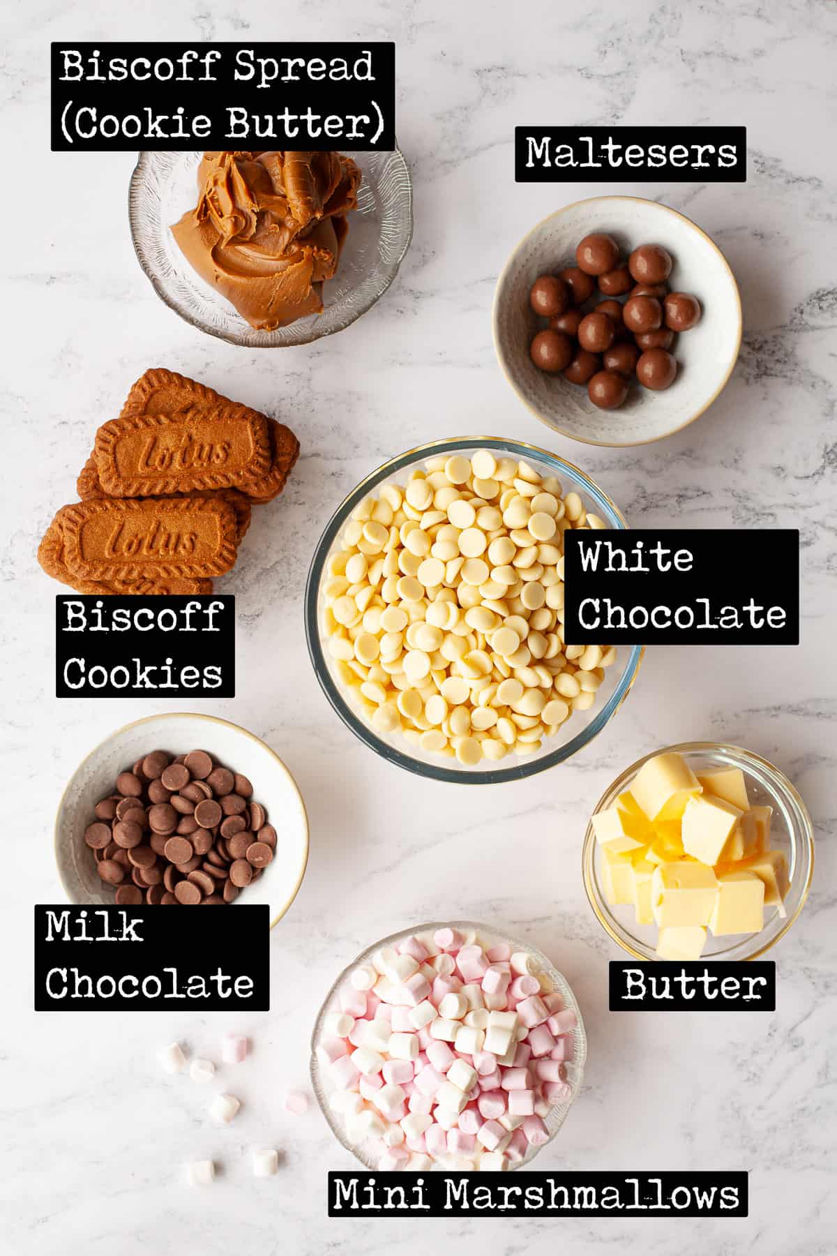 Ingredients with text overlay for a white chocolate and cookie butter bar recipe.