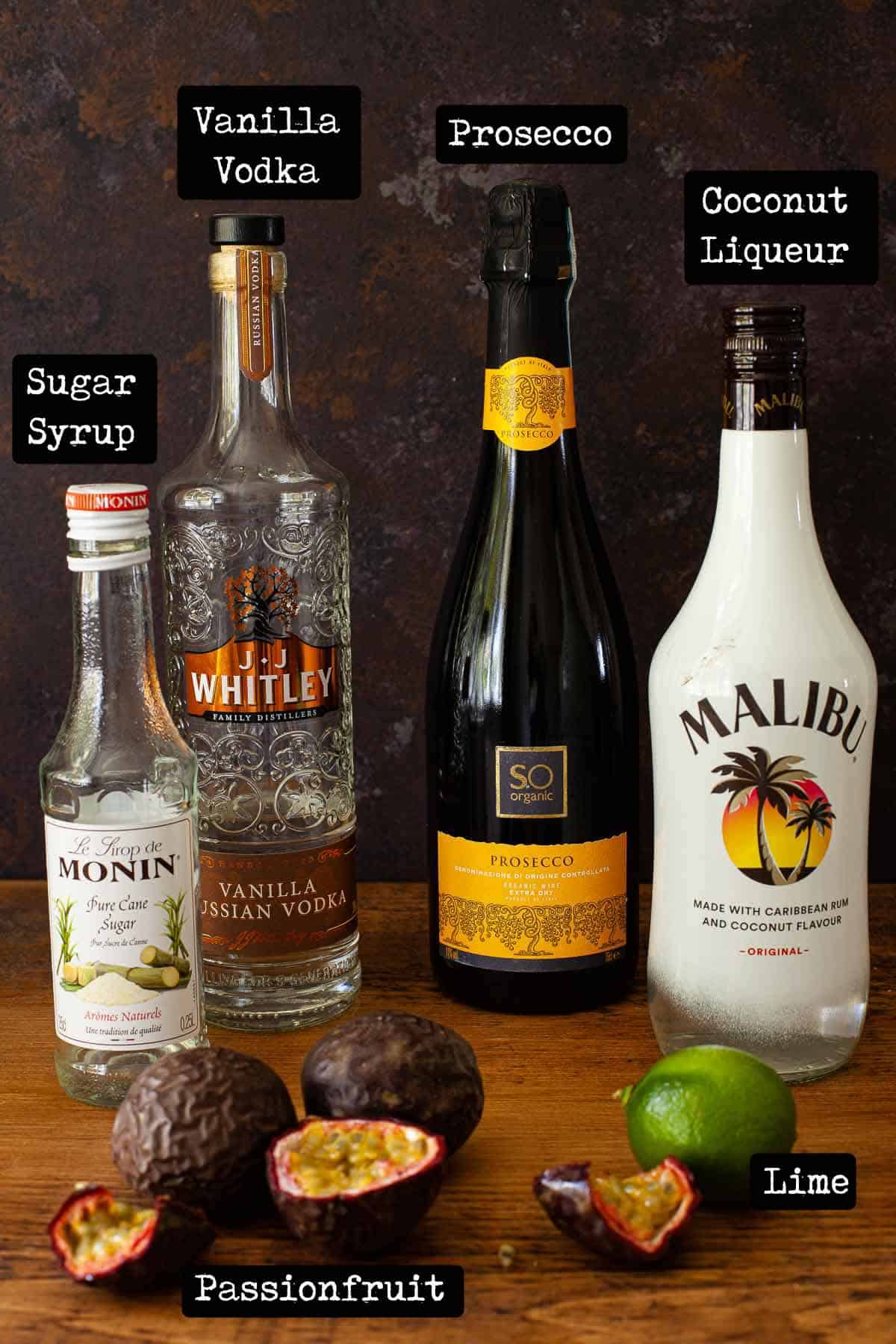 Bottles of alcohol and fruit with text overlay - ingredients for a cocktail