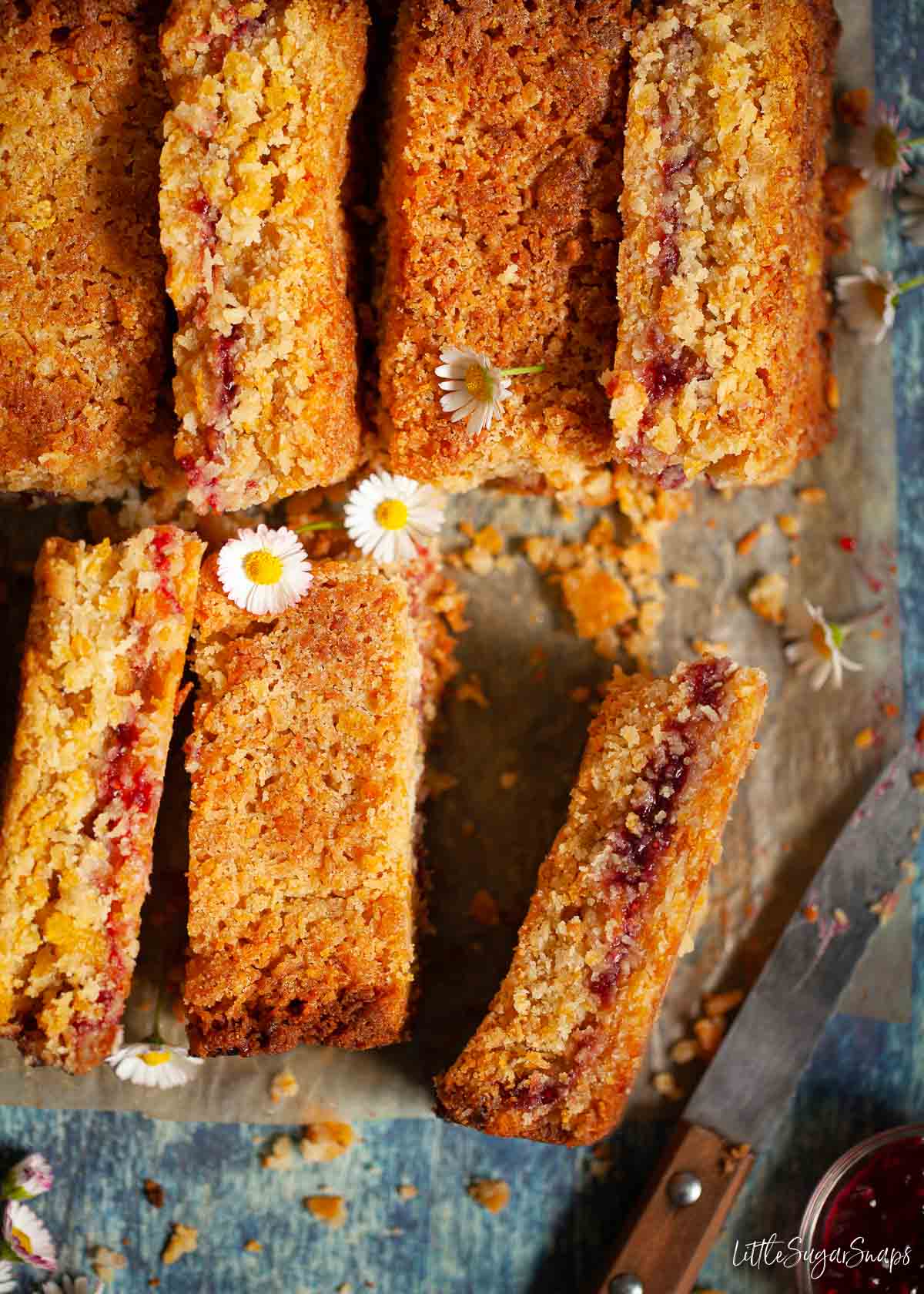 Close up of cut up cornflake bars with a jam centre