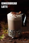 Christmas spiced latte topped with cream with text ovelay.