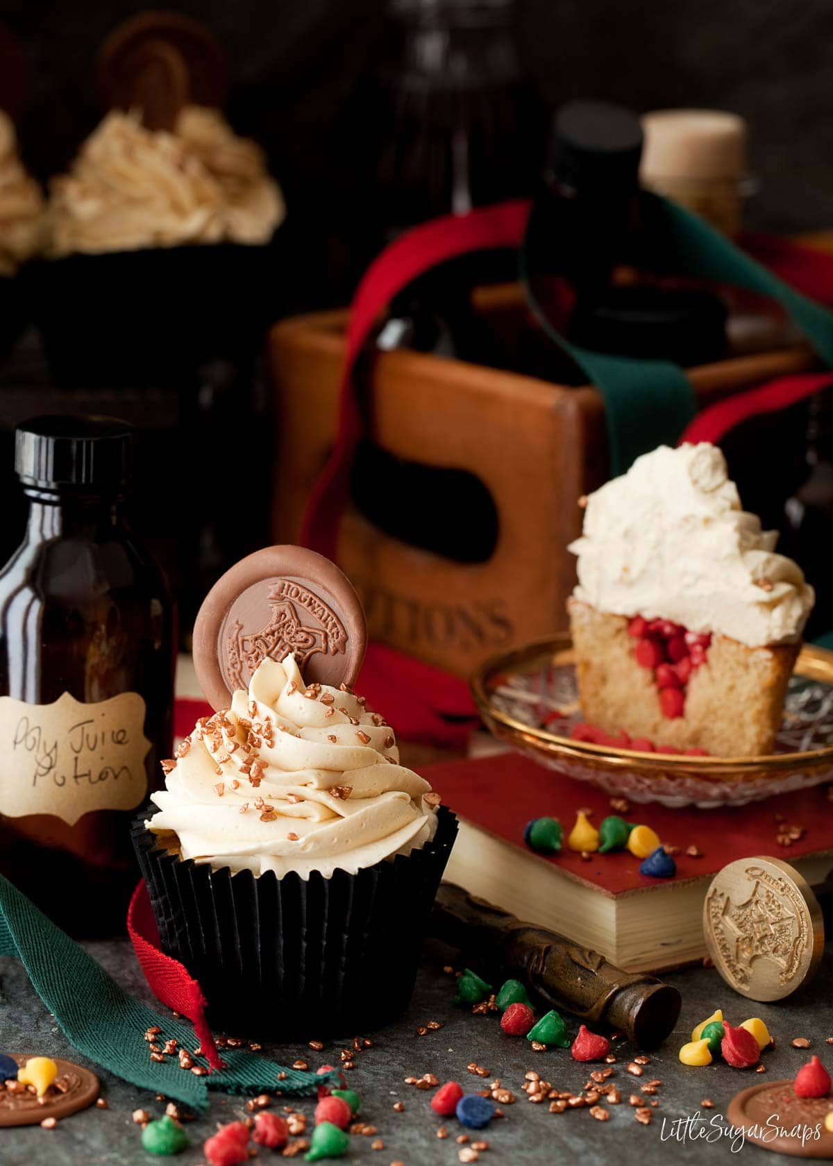 Harry potter sorting hat cupcakes with Gryffindor coloured candy drops inside