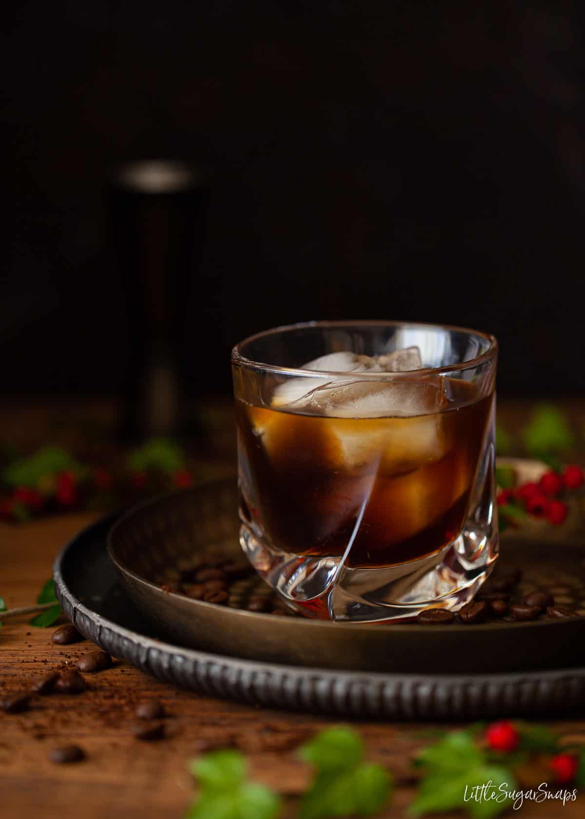 A black Russian Gingerbread cocktail in a rocks glass filled with ice.